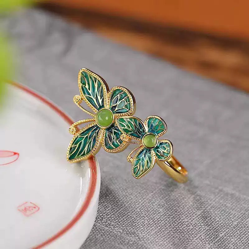 Close-up of the double butterfly ring showing the green detailing