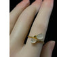 Adjustable double lotus pod ring shown on a hand