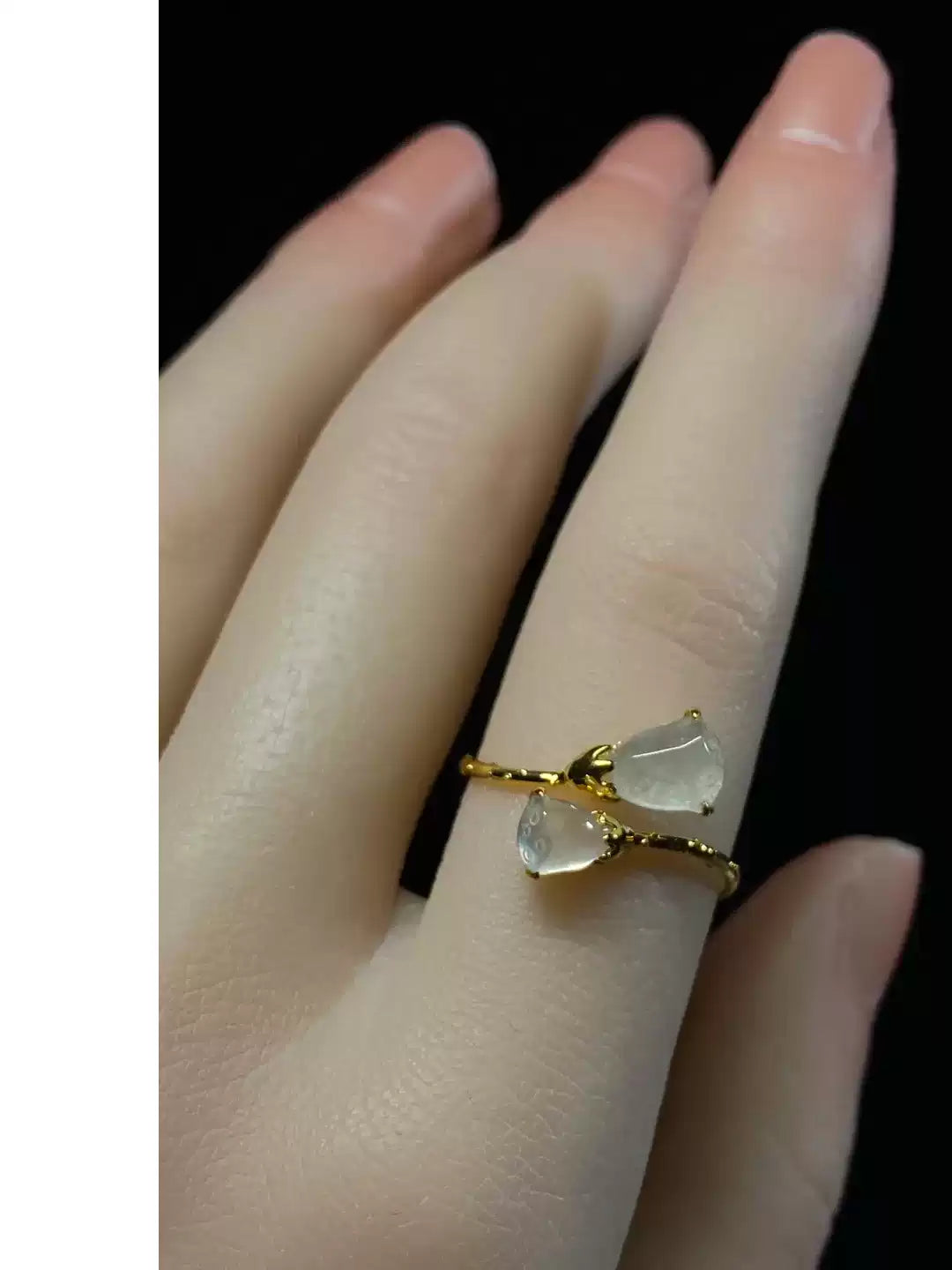 Adjustable double lotus pod ring shown on a hand