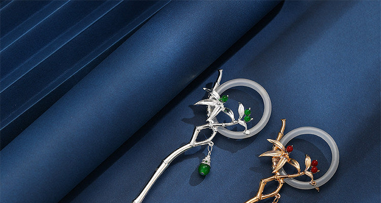 Gold and silver bamboo tassel hairpins side by side