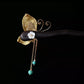 Reverse view of the butterfly ornament and dangling beads
