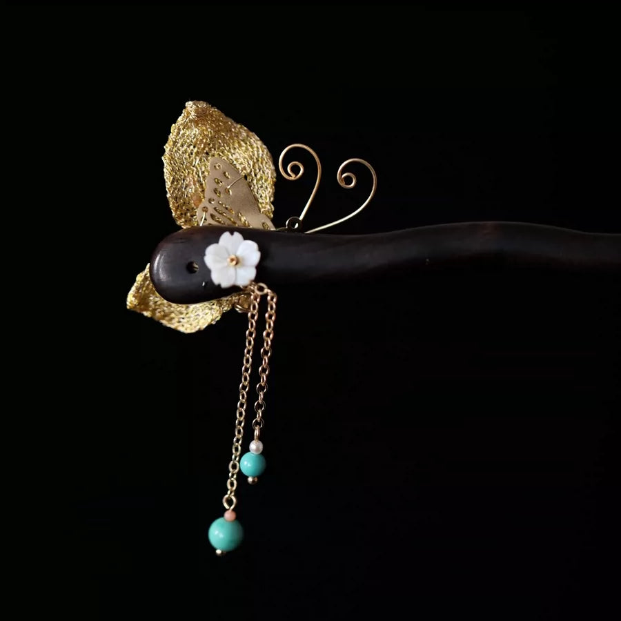 Reverse view of the butterfly ornament and dangling beads