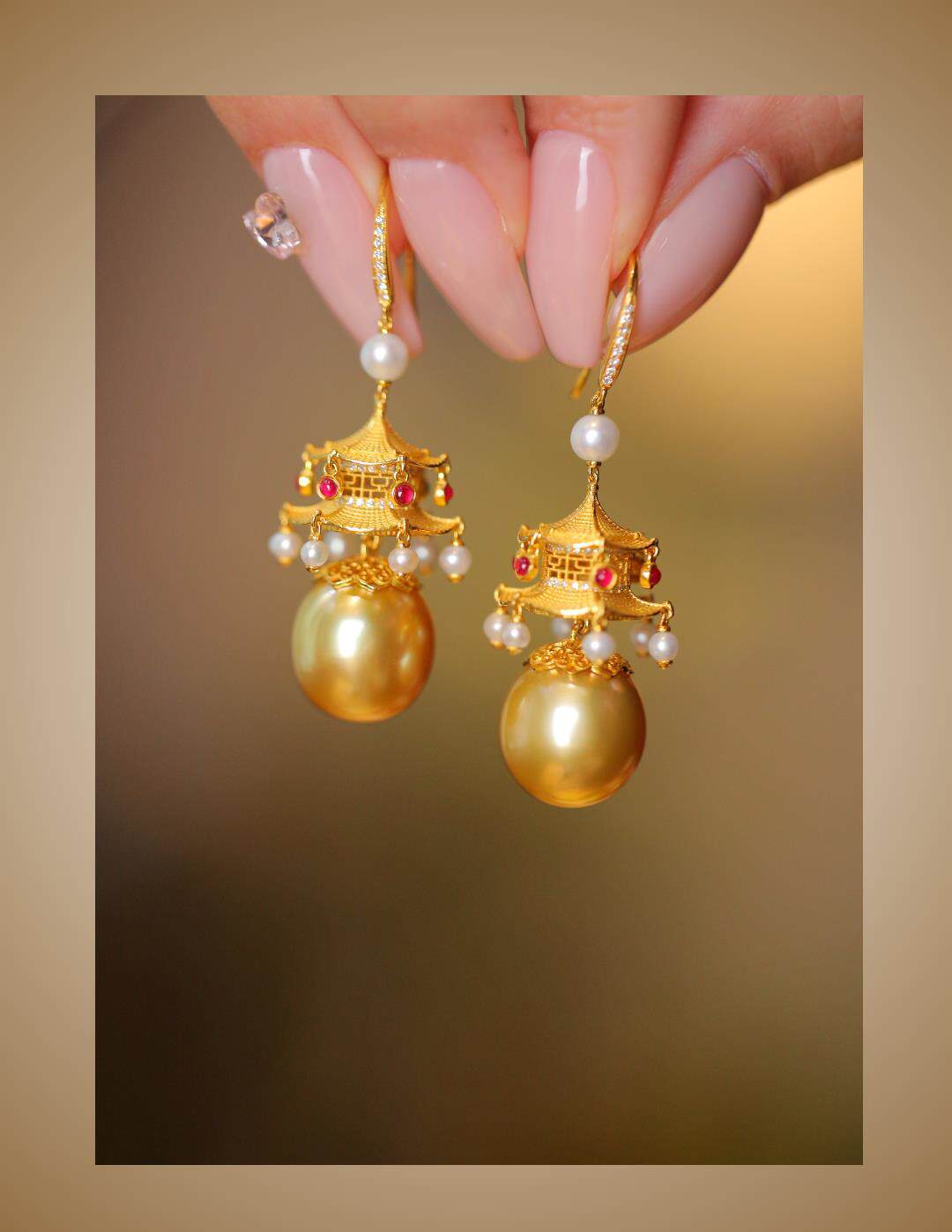 Pair of pavilion-inspired drop earrings shown close up