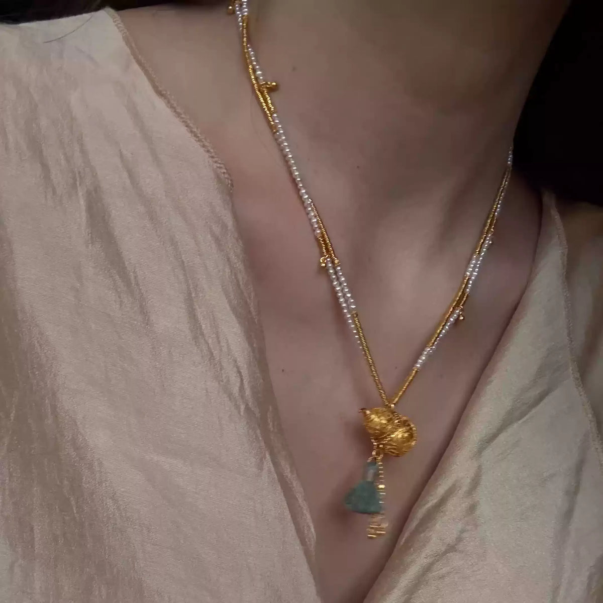 Double-layer gourd pendant necklace shown at the collarbone