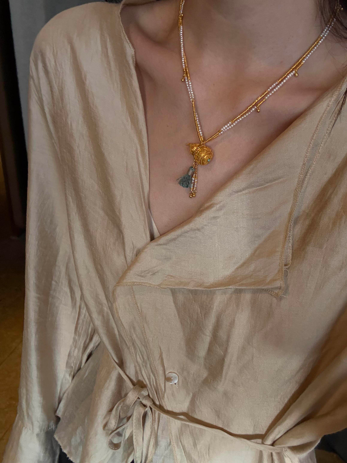 Full view of the double-layer gourd necklace with pendant and tassel