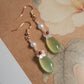 Pair of green agate earrings with white mother-of-pearl flowers and red agate accents