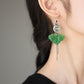 Green butterfly earrings shown in a side profile