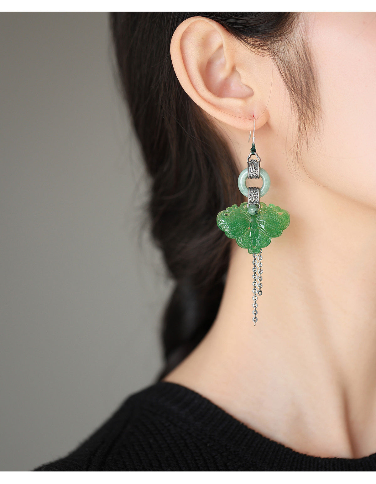 Green butterfly earrings shown in a side profile
