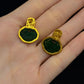 Back and post fastening view of the green and gold-tone stud earrings
