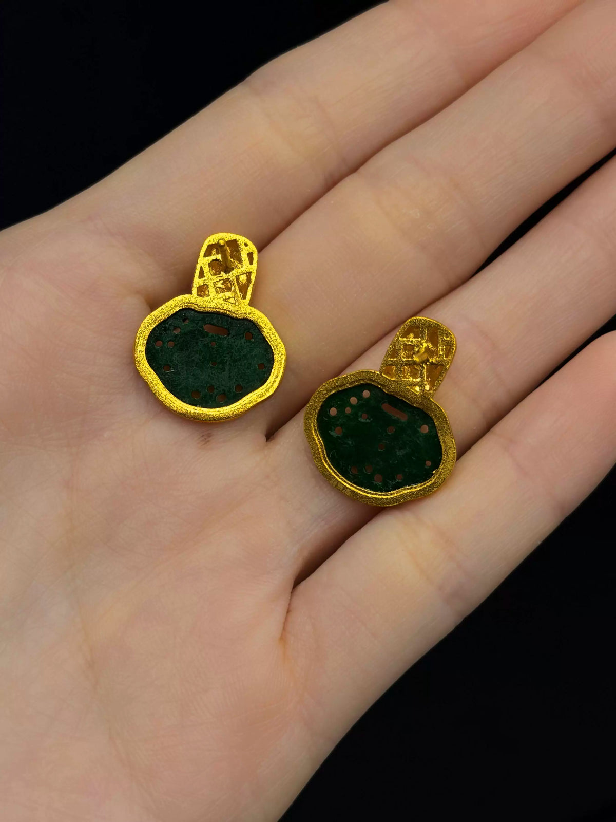 Back and post fastening view of the green and gold-tone stud earrings