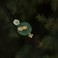 Close-up of the green lotus-leaf motif and gold-tone center