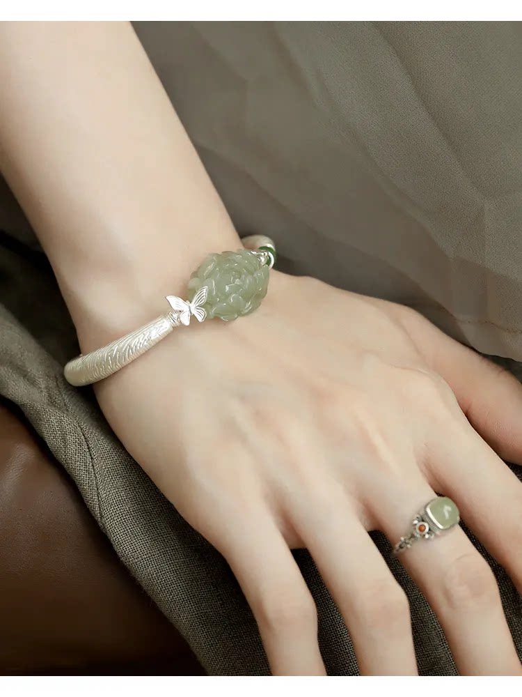 Second wrist view of the green peony and butterfly cuff bracelet