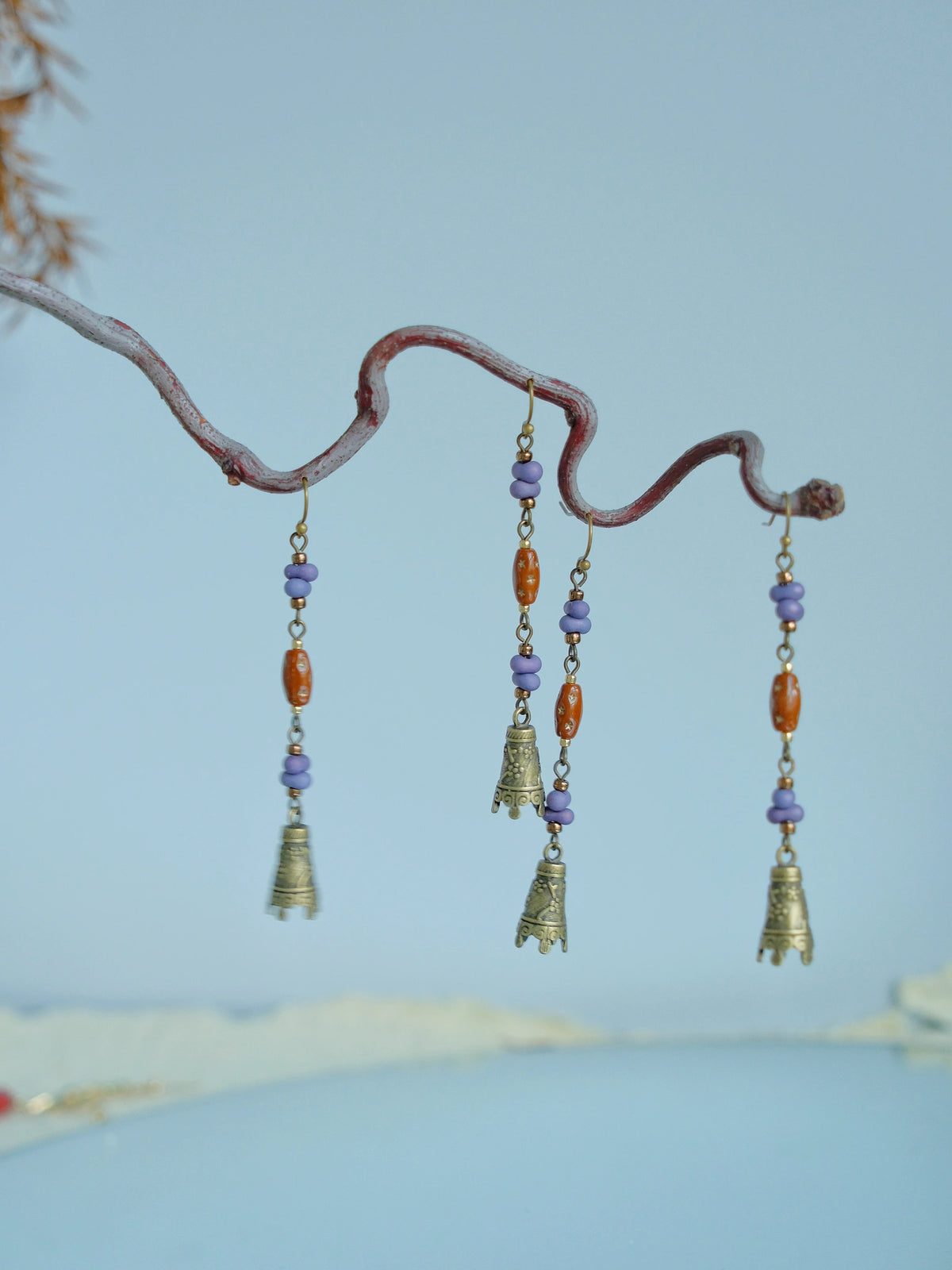Alternate display of the long bell earrings on a branch