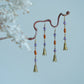 Hua Ling earrings displayed on a branch; each order includes one pair