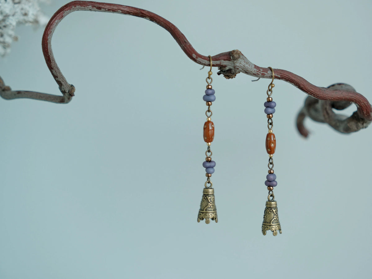 Pair of Hua Ling purple bead drop earrings with antique bronze-tone bell charms
