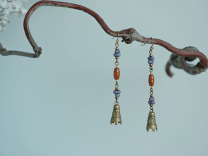 Pair of Hua Ling purple bead drop earrings with antique bronze-tone bell charms