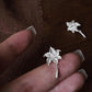 Close-up view of a lily flower earring and its post backing