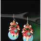 Detailed view of the koi fish earring pair