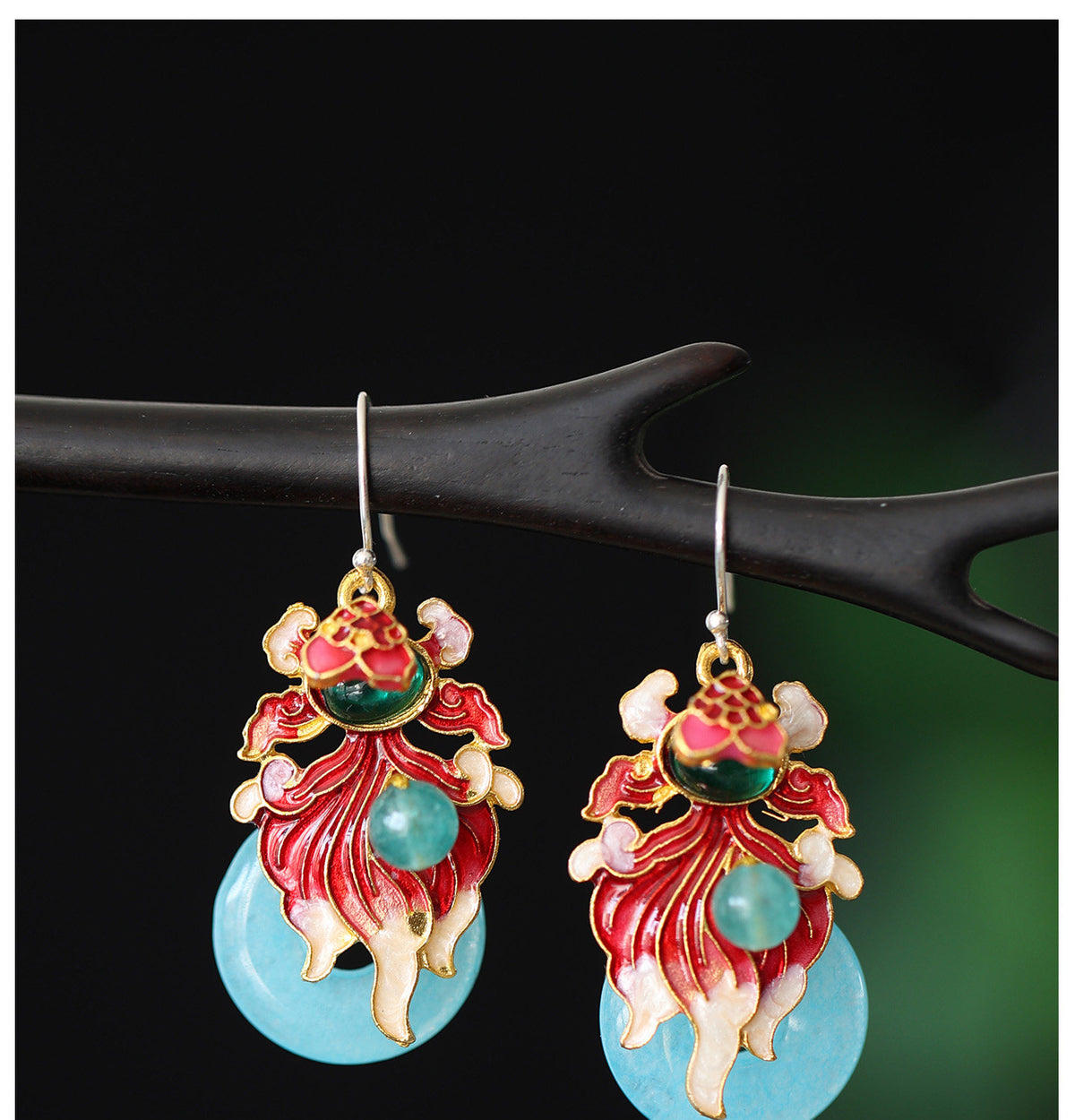 Detailed view of the koi fish earring pair
