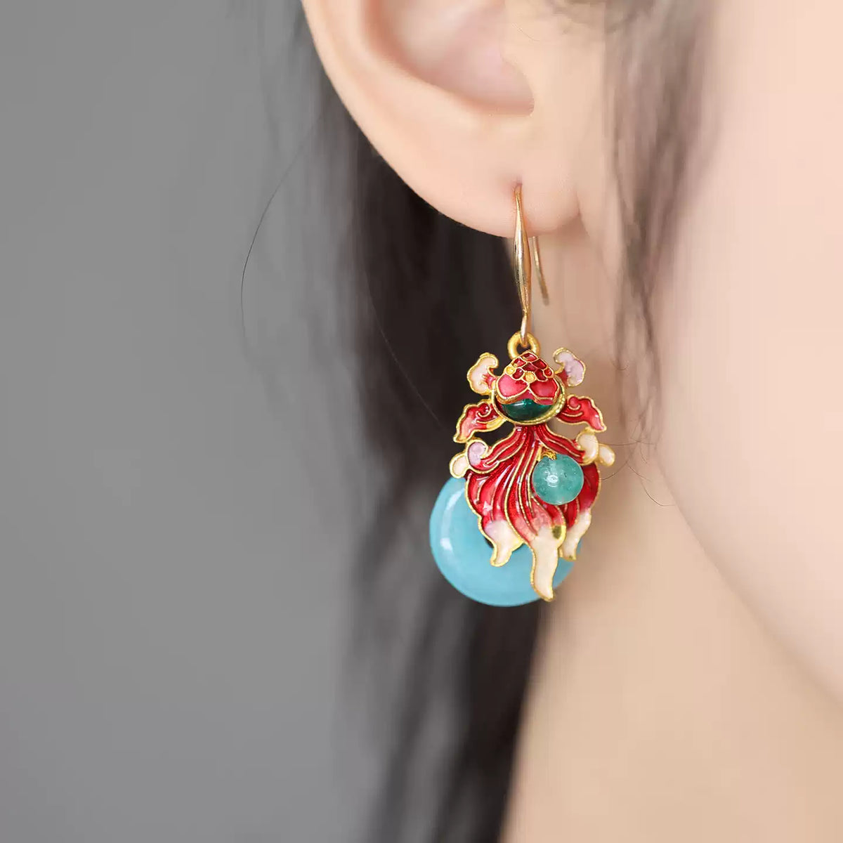 Close-up showing the colorful dangling koi fish design