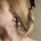 Silver-tone lotus petals, fine chain and round blue-green bead details