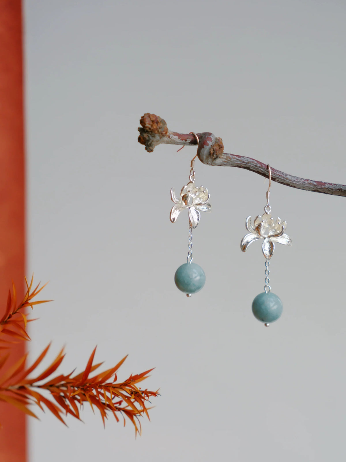Lian Yi silver-tone lotus earrings with blue-green round bead drops, hook style