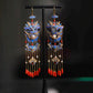 Full-length view of the lion-dance earrings with long chain tassels