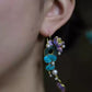 Side view of the dangling lotus earrings