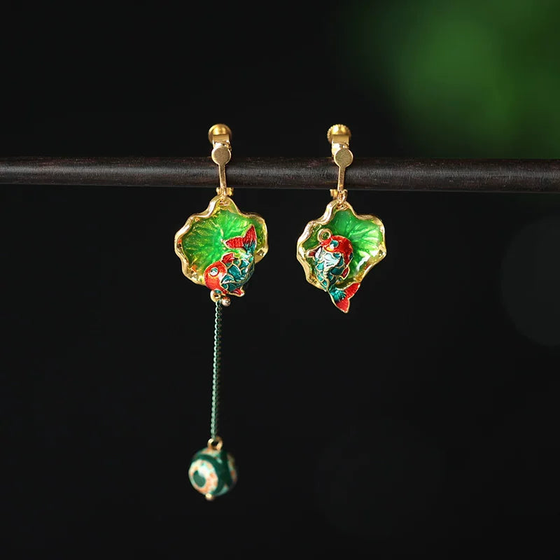 Green koi earrings with gold-tone clip-on fastening