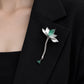 Lotus waterdrop brooch worn on a blazer