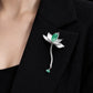 Close view of lotus waterdrop brooch worn on a blazer