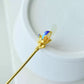 Close-up of the silver-tone magnolia hairpin