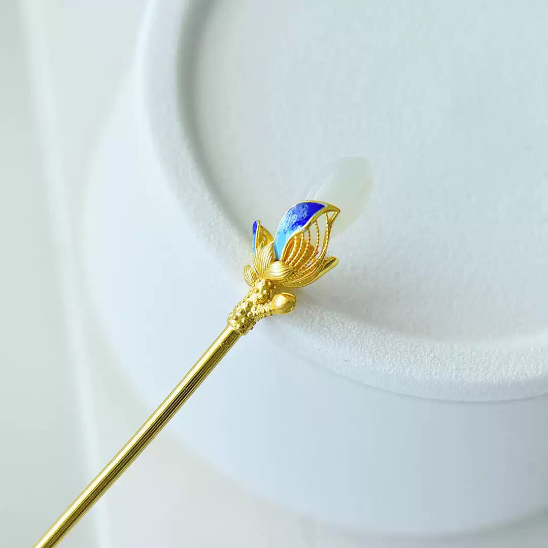 Close-up of the silver-tone magnolia hairpin