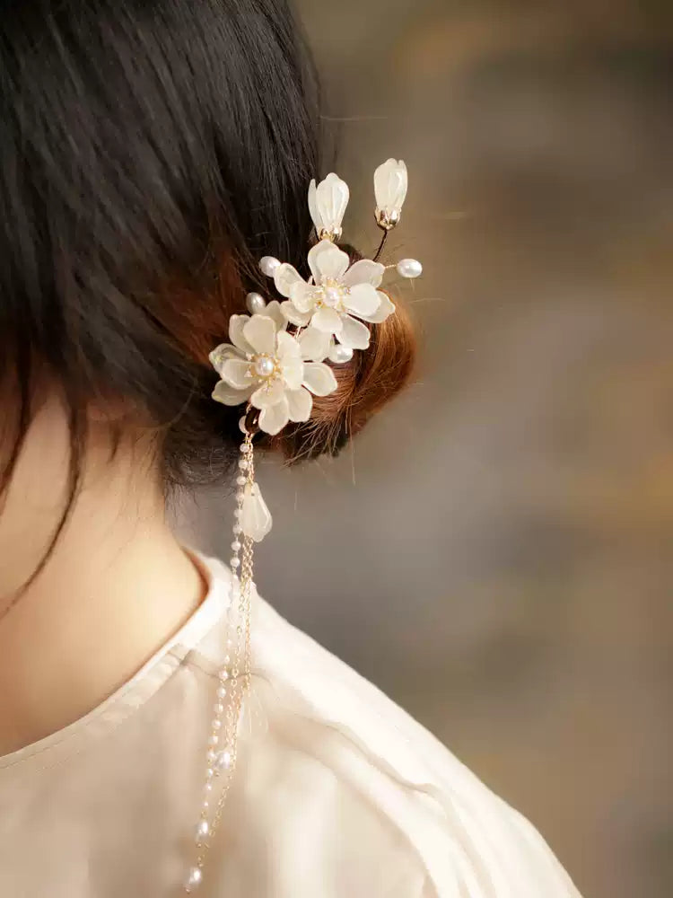 Ivory magnolia hair clip styled with an updo