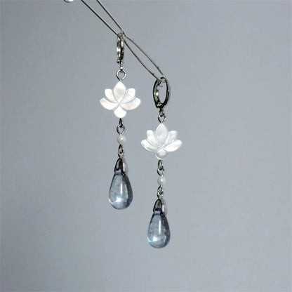 White mother-of-pearl lotus drop earrings with silver-tone hoops and blue-gray teardrop pendants