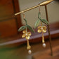 Close product view of the golden osmanthus leaf tassel earrings