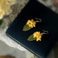 Short golden osmanthus flower earrings with green leaves, product detail