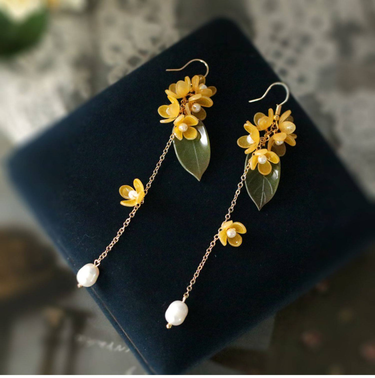 Pair of long golden osmanthus flower and leaf tassel drop earrings with white bead drops