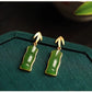 Pair of green bamboo segment stud earrings viewed from the front