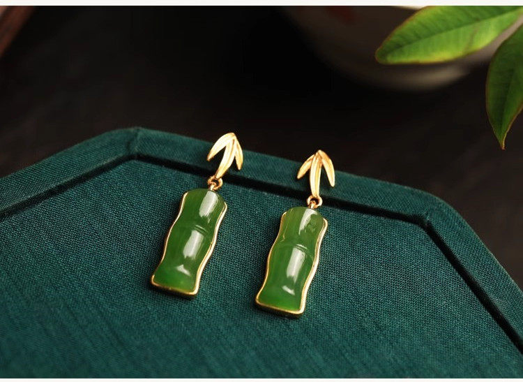 Pair of green bamboo segment stud earrings viewed from the front