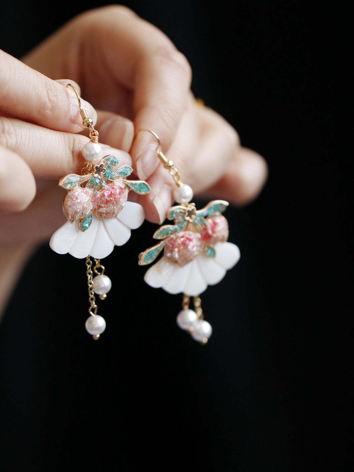 Pair of peach tassel earrings with botanical details
