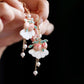 Detail of peach tassel earrings