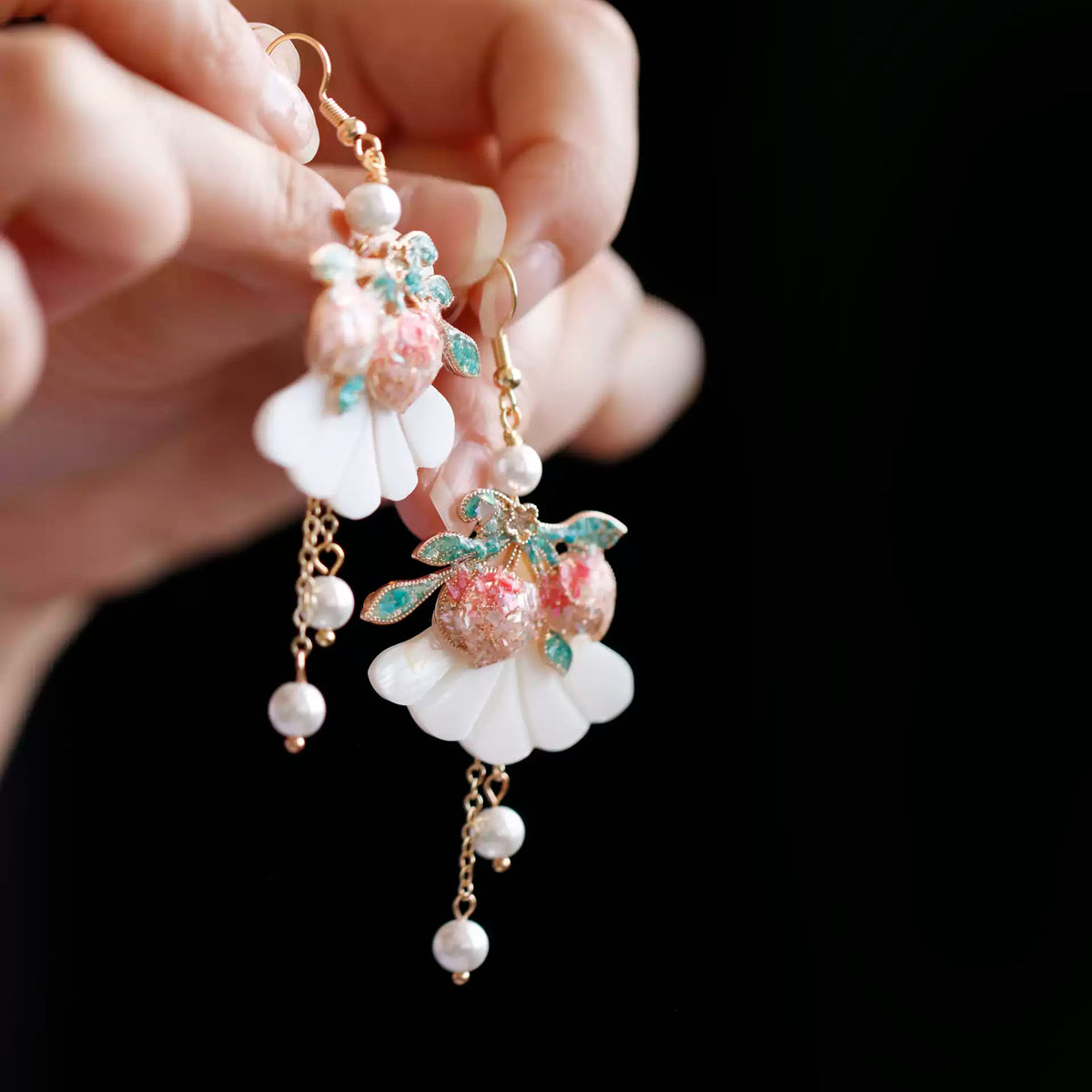 Detail of peach tassel earrings