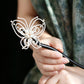 Close-up view of the butterfly hairpin in use