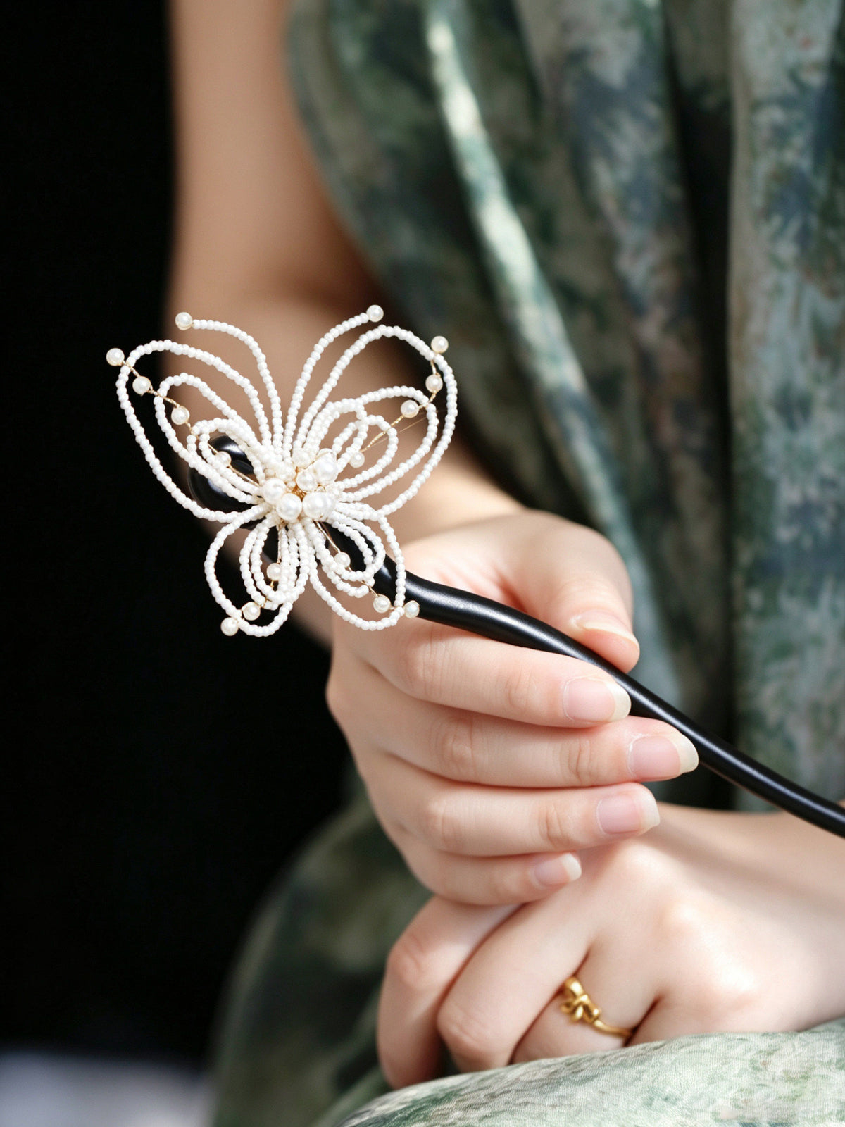 Close-up view of the butterfly hairpin in use
