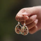 Pink floral drop earrings with faux pearl frames and gold-tone findings