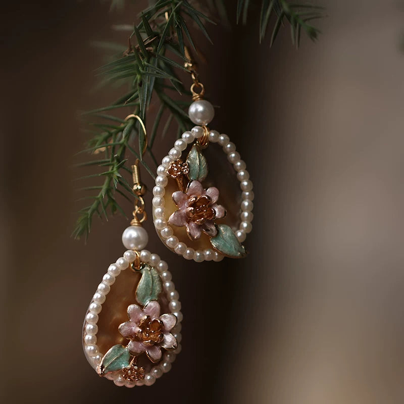 Pink shell flower drop earrings with faux pearl border and gold-tone hooks