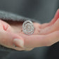 Product video showing the adjustable silver-tone openwork floral ring