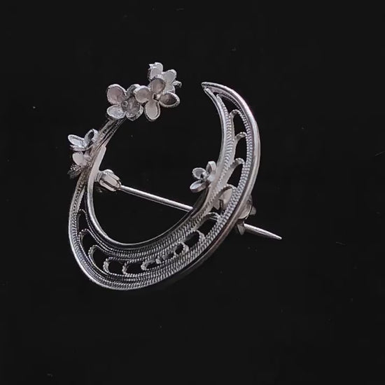 Product video showing the silver-tone copper crescent moon floral brooch