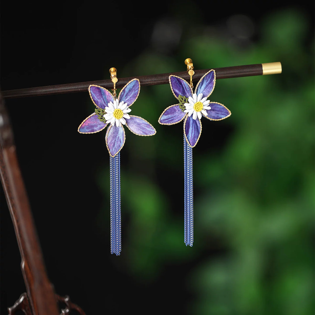 Purple floral earrings with gold-tone clip-on fasteners